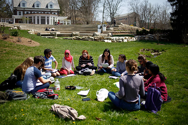 Students gathering for a class with their notes